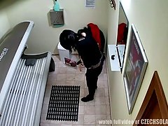 Hidden camera reveals a dark-haired Czech babe playing with her shaved pussy in a tanning bed