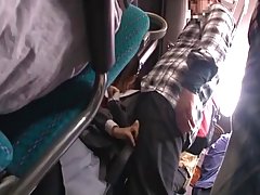 A horny man is putting his fingers in a young Japanese babe’s panties, while in the bus