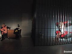 Horny police officer is masturbating while watching a bonde chick in the prison cell doing the same
